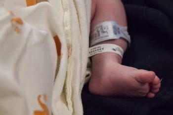 Tiny Baby Feet with hospital tags on them