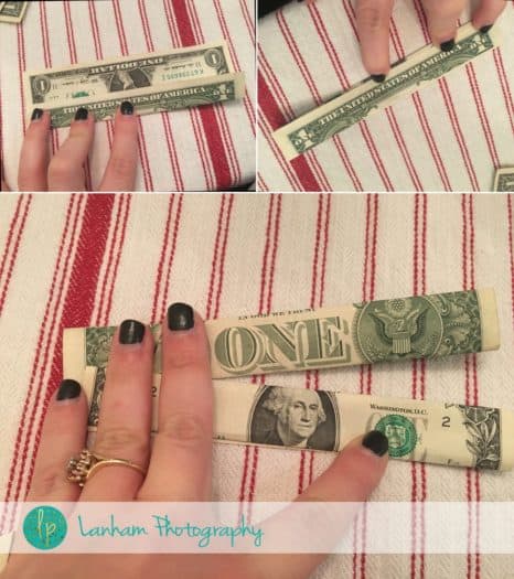 Folding crisp one dollar bills