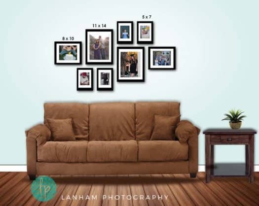 Wall Gallery with seven pictures hanging on the wall, a brown couch, a side table with plant on it, and a wood floor
