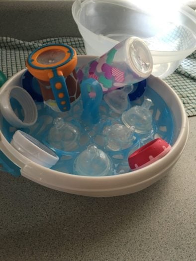 baby bottles in bowl to dry