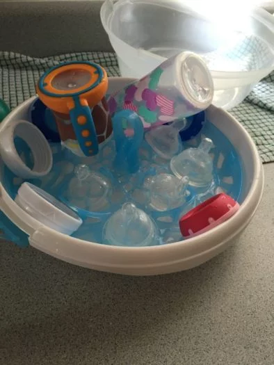baby bottles in bowl to dry