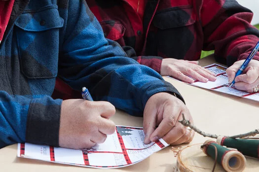 People wearing flannels writing on the lumberjack printable  