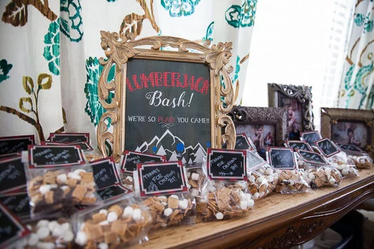 Lumber jack bash picture framed with gift baskets on table 