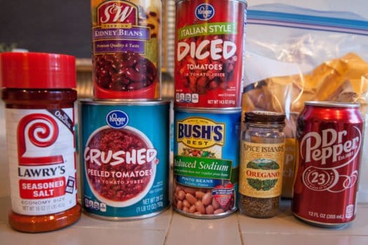Chili ingredients including diced tomatoes, kidney beans, bush's beans, lawry's salt, oregano and dr pepper