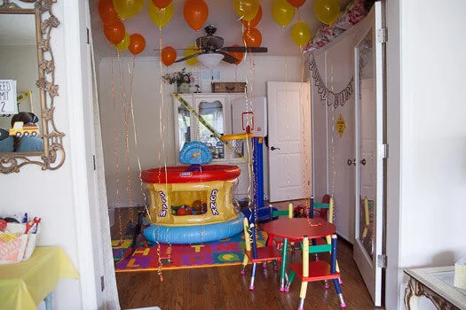 playroom with ball pit and balloons in it 