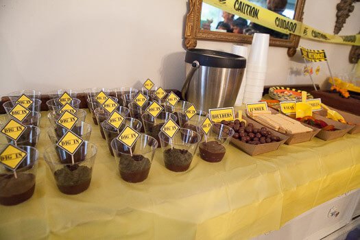 dessert table with pudding dirt cups and candy 