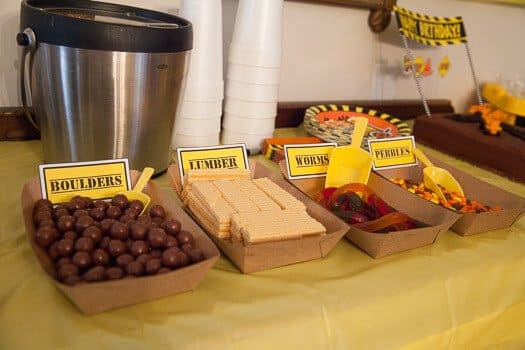 Candy described as boulders, lumber, worms, and pebbles on dessert table