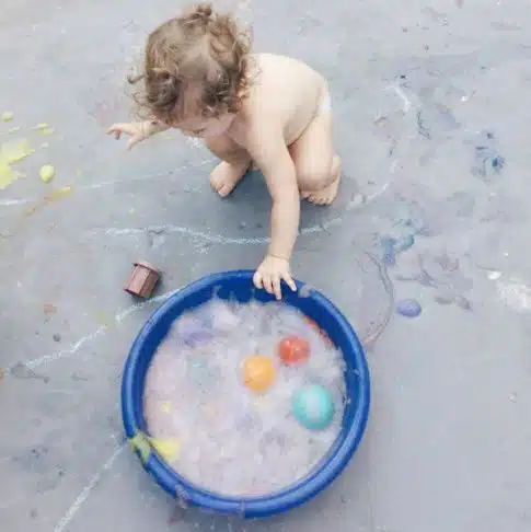 Toddler playing with textures