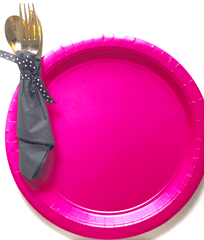 Silverware wrapped in gray napkin and pink plate
