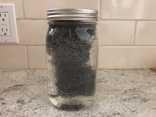 Steel wool in mason jar filled with vinegar