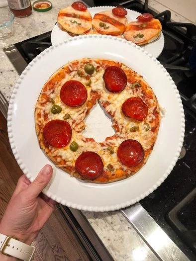 Finished pizza with Christmas tree cut out of middle
