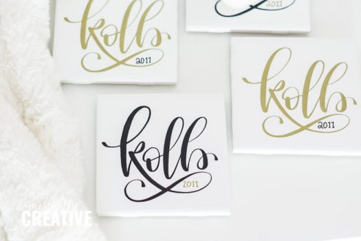 personalized white coasters with kolb 2011 written in calligraphy either written with black or gold ink 