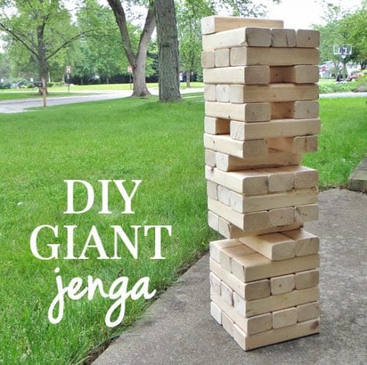 DIY Giant Jenga overlaid on green grass with giant jenga next to it on concrete 