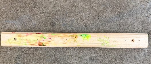 Piece of wood with some waterbased paint 