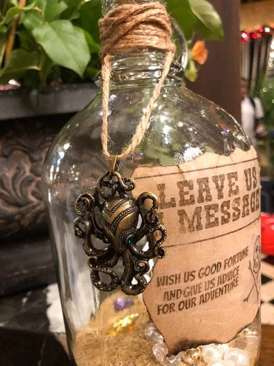 Pirate styled jar focusing in on giant octopus charm hanging