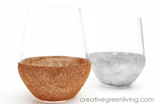 2 stemless wine glasses 1 has gold glitter bottom half of glass. the other has silver glitter bottom half of glass.  creativegreenliving.com