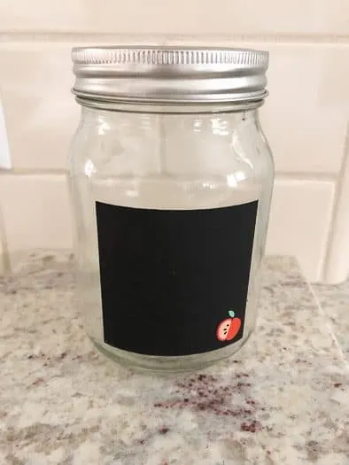 Mason jar with chalkboard label and apple