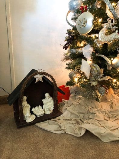 nativity scene under Christmas Tree