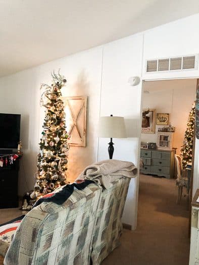 faux Christmas tree in living room and one in bedroom