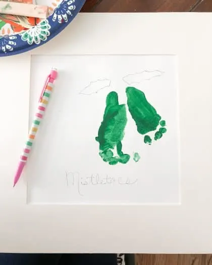 Green Color painting of toddler feet