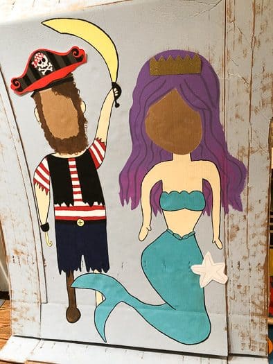 Painted in chalk drawings of pirate and mermaid on cardboard 