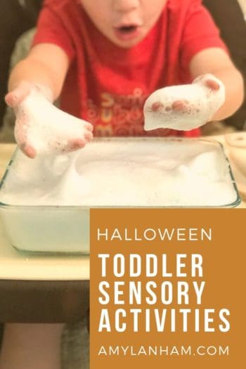 Halloween Toddler Sensory Activities overlaid by toddler with foam on hands from DIY foam in container
