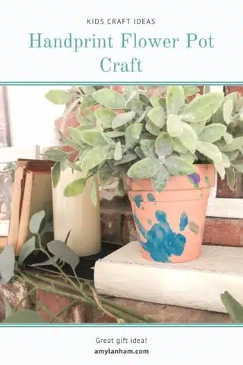 Handprint Flower Pot Craft with blue painted handprint on pot