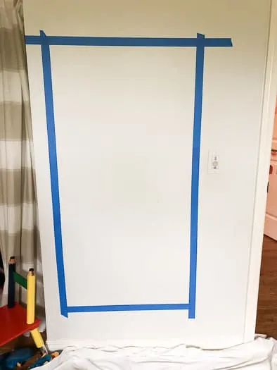 Chalkboard with blue tape on it