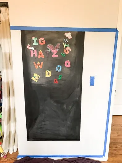 Magnetic chalkboard with alphabet letters on it 