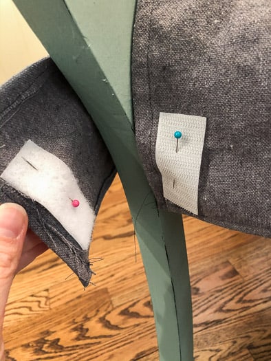 Velcro pinned onto the grey fabric