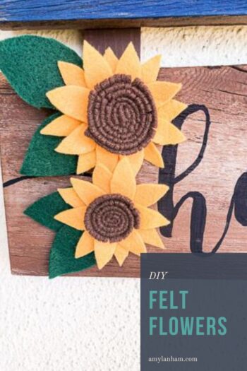 Felt Sunflowers on a brown sign, pin image with text overlay that says DIY flowers