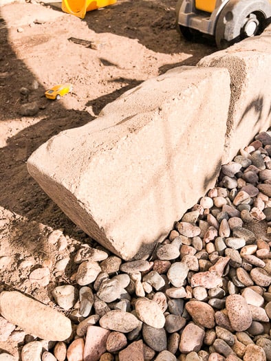 stones separating the rock from the dirt