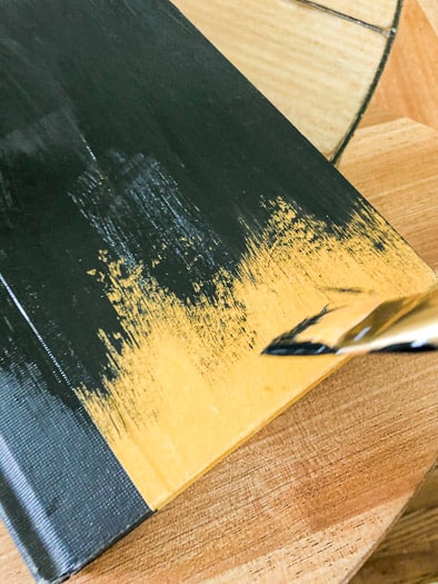 Painting the yellow cover a book black