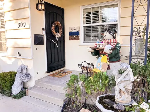 front porch with a wreath hanging on the front door