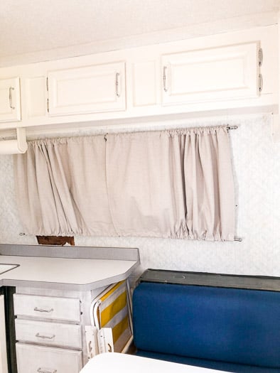 drop cloth curtain on trailer window, cabinet doors 