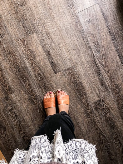 grey vinyl flooring with feet standing