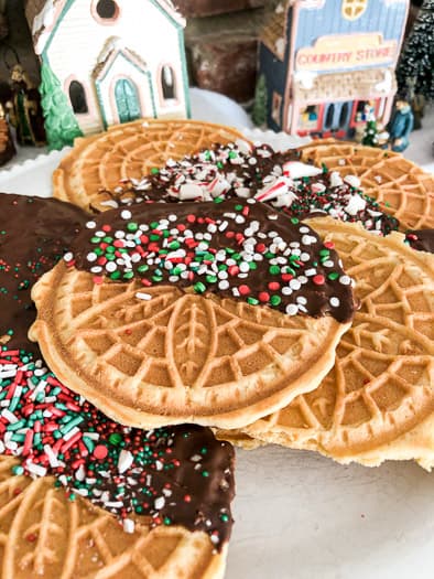 Pizzelles in from of a christmas village