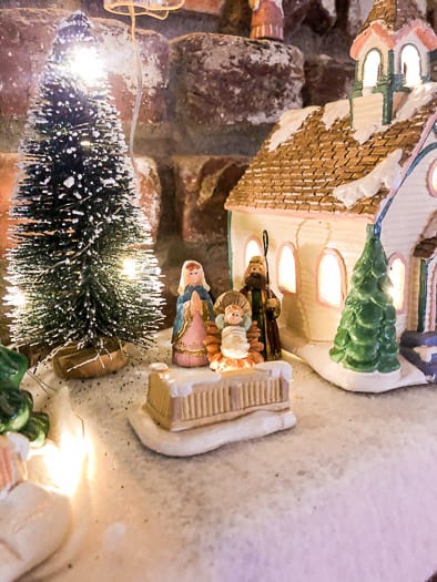 Tiny nativity set in a Little Christmas village on my mantel.