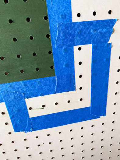 tape lines on a pegboard