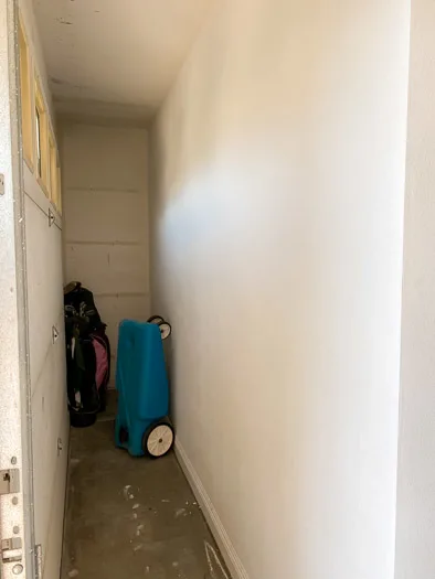 alcove between a garage door and a wall