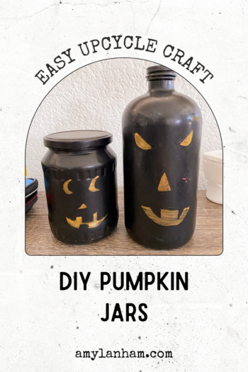 pin image, 'easy upcycle craft' image of 2 jars painted black with gold eyes, nose, and mouth to look like pumpkins, 'diy pumpkin jars'