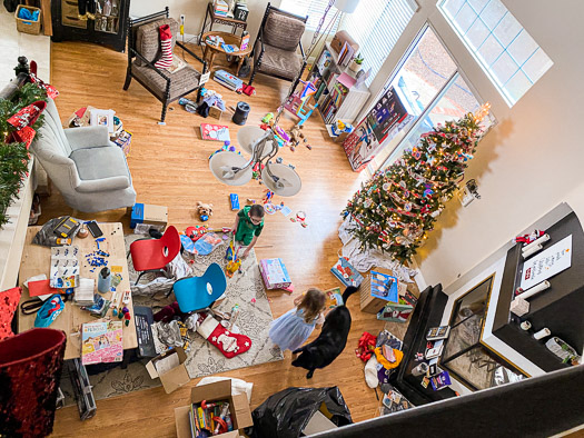 birds eyes view of Christmas morning destruction. Toys scattered everywhere and a Christmas tree on the right hand side