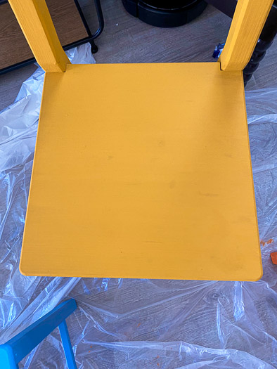 close up of a yellow chair seat with minimal staining showing