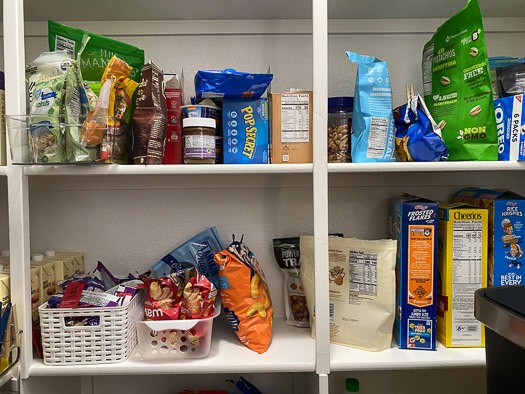 2 shelves of snacks that are easy for kids to get themselves