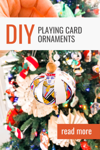 playing card ornament in front of a christmas tree