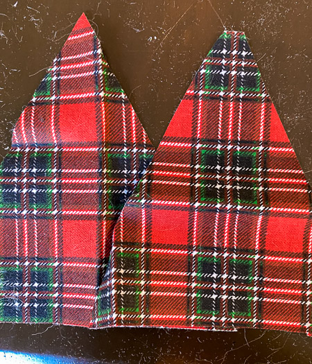 2 triangles cut from red and green fabric