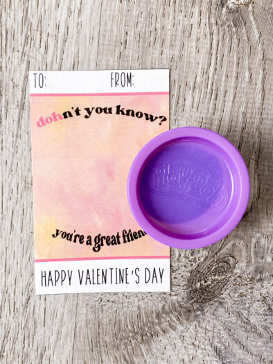 purple playdoh next to a cardstock card that says 'dohn't you know? you're a great friend!'