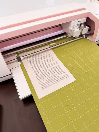 Cricut cutting a book page