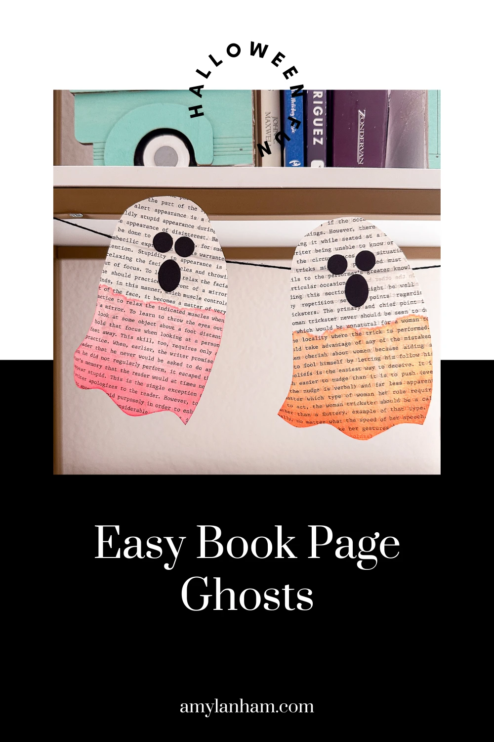2 book page ghosts with their bottom halves painted, one red, one orange.