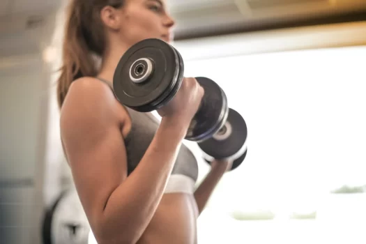 a woman holding weights